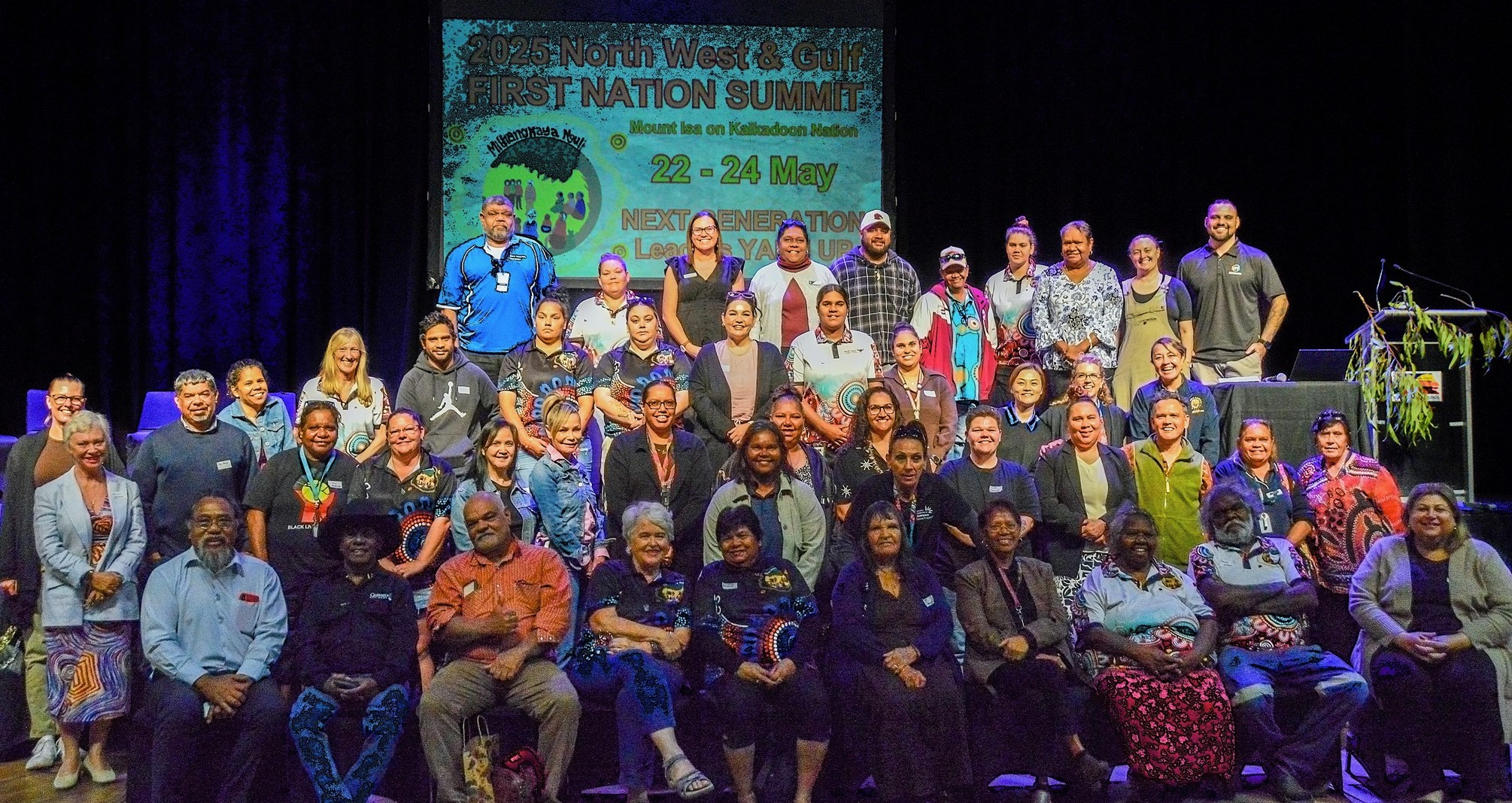 Group photo of participants at the 2025 North West & Gulf First Nations Summit in Mount Isa, gathered outdoors on Kalkadoon Country, celebrating community, culture and collaboration.